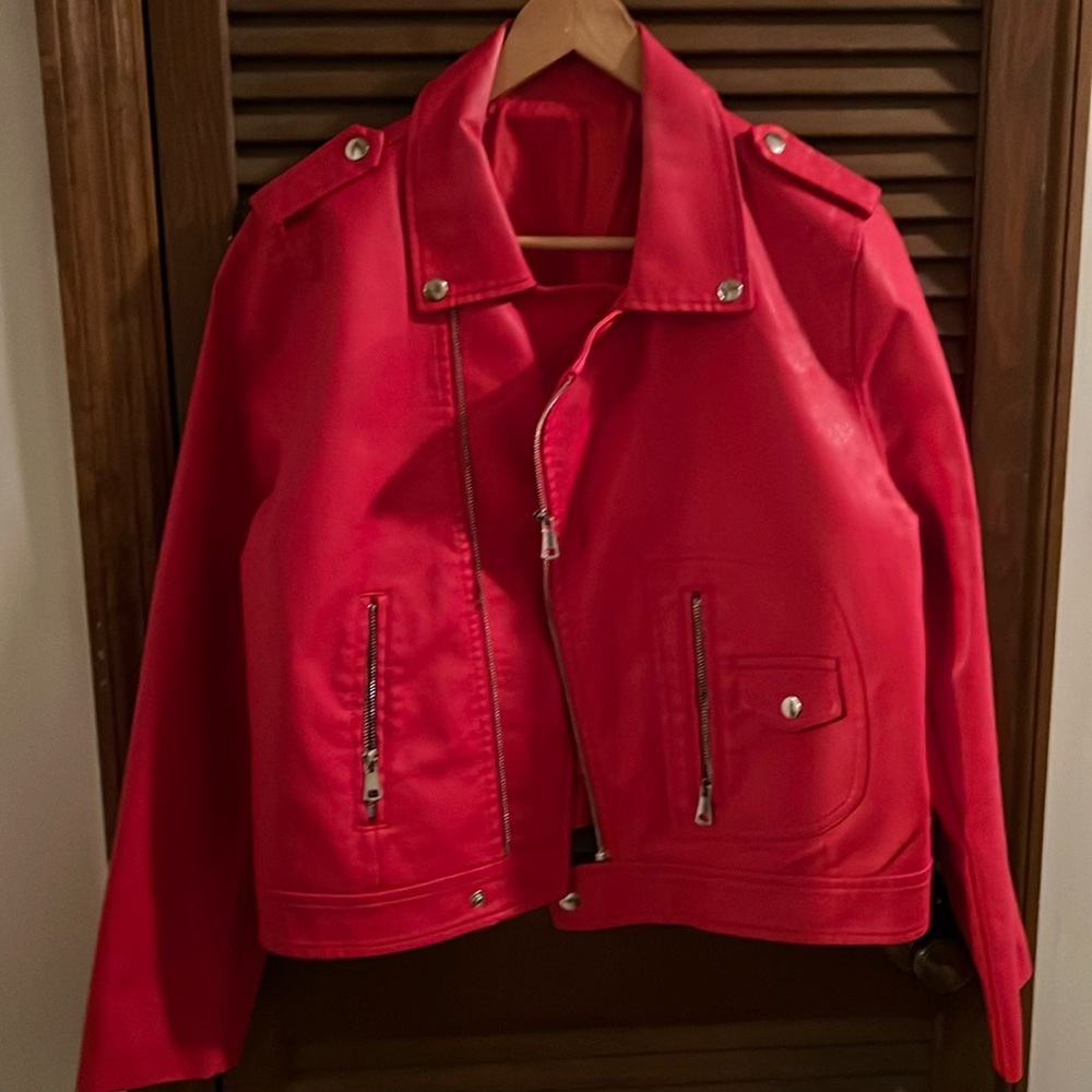 Women’s RED faux leather jacket. Never worn. Zipper/ two pockets.